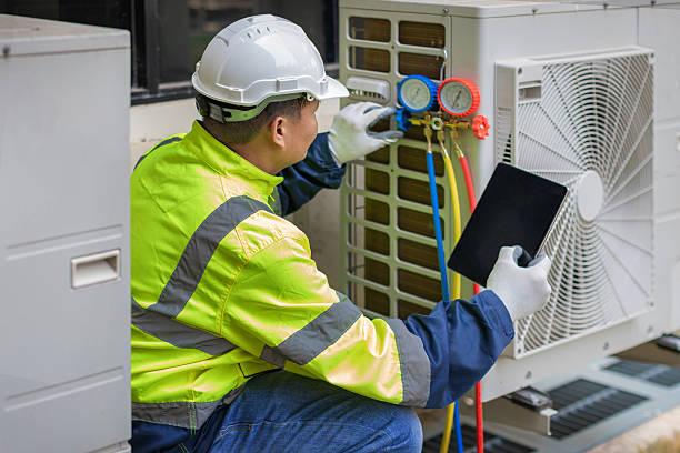 Professional Hvac technician working in Raynham, MA